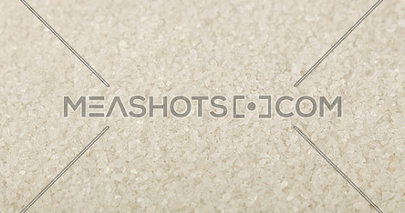 Close up background texture of white sea salt, high angle view, selective focus