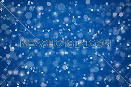 Abstract indigo blue Christmas holiday winter background of falling snow bokeh, sparkles and glitter