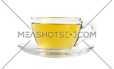 Close up one transparent glass cup of green oolong or herbal tea on saucer isolated on white background, low angle side view