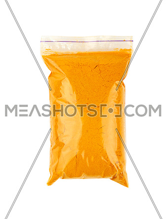 Close up one plastic zip lock bag full of yellow turmeric powder spice isolated on white background