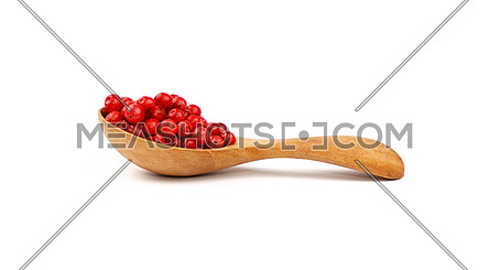 Close up one wooden scoop spoon full of red pink pepper peppercorns isolated on white background, elevated top view, directly above