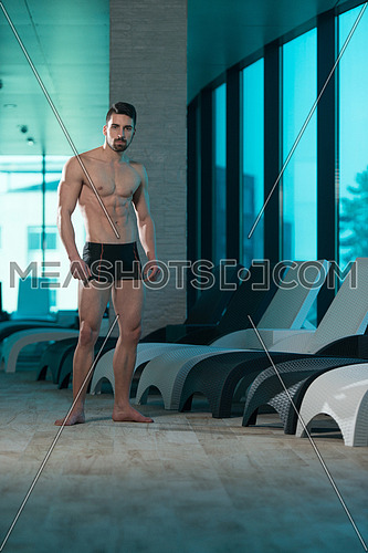 Sexy muscular young man in underwear look in window wake up at home  bedroom. Young toned athletic guy in briefs advertise underclothes intimate  garment. Recommendation, fashion concept. Stock Photo