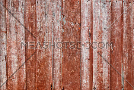 Close up background texture of brown red vintage painted weathered wooden planks, rustic style wall or fence