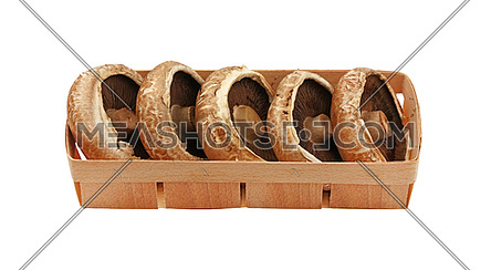 Close up one wooden crate box of fresh brown portobello mushrooms isolated on white background, high angle view