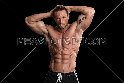 Muscular Bodybuilder Man Posing Over Black Background-95144 | Meashots