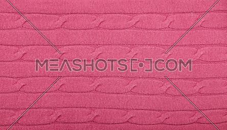 Close up background of pink knitted wool jersey fabric texture