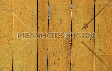 Close up background texture of yellow rustic painted wooden planks, rustic style wall panel