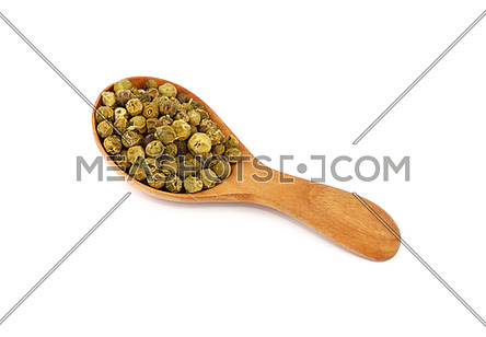 Close up one wooden scoop spoon full of green pepper peppercorns isolated on white background, high angle view