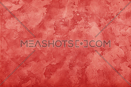 Grunge red faded uneven old aged daub plaster wall texture background with stains and paint strokes, close up