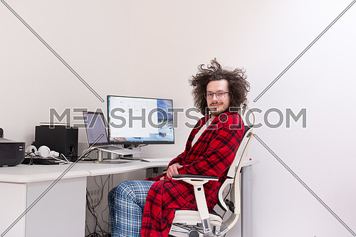 graphic designer in bathrobe working at home-180906 | Meashots