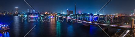 Panorama for the River Nile showing Kasr El Nile Bridge and Cairo Tower at Night.