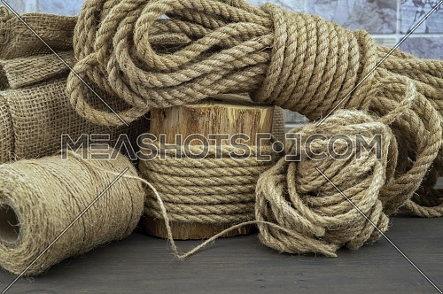 Jute rope and spools of burlap threads or twine-247466