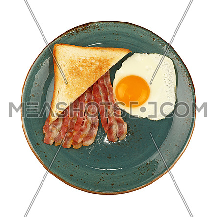 Close up English breakfast, sunny side egg, toasted bread and roasted bacon slices on blue plate isolated on white background, elevated top view, directly above