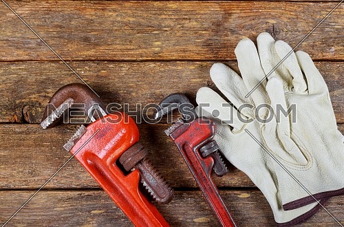Wrench plumbing leather safety gloves construction concept.-223386