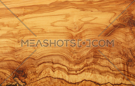 Close up yellow and brown pattern of olive wood woodgrain texture background