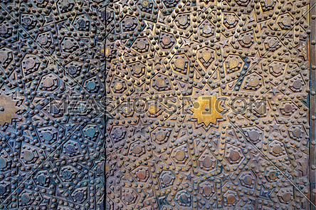 Ornaments of the bronze-plate door at Al Sultan Hasan Mosque, historic public mosque located in Cairo, Egypt