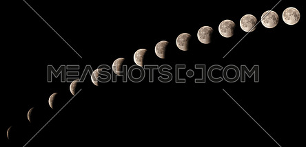 Time series of lunar eclipse on July 27 2018, sequence of phases from 11:20 pm to 12:31 am, captured in Cairo, Egypt. Assembled of 14 photos with almost five minutes time interval between each other