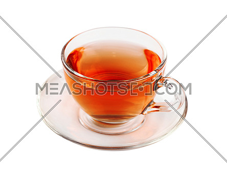 Close up one transparent glass cup of black tea on saucer isolated on white background, high angle view