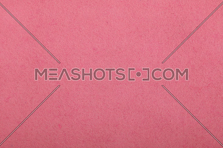 Pink felt textile material background texture close up