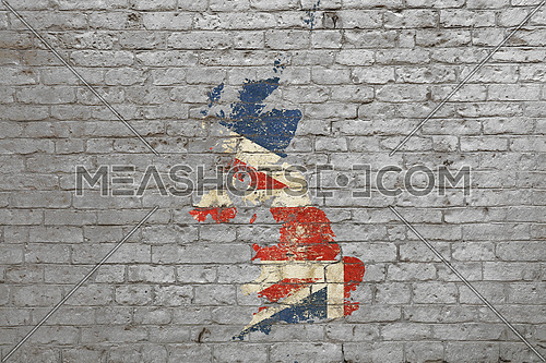 Grunge distressed map shaped flag of Britain painted on old weathered grey brick wall