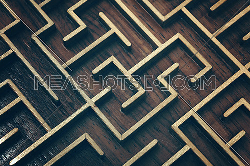 Close up of dark brown wooden labyrinth maze, toy puzzle game, elevated high angle view