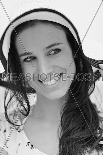 portrait of happy young woman on beach at summer vacation