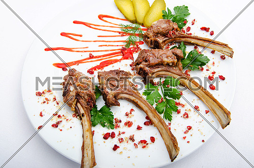 Lamb ribs served in the plate