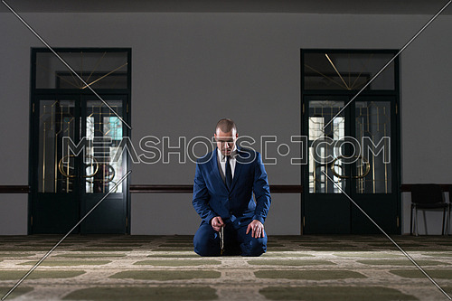 Businessman Muslim Making Traditional Prayer To God Allah In The Mosque