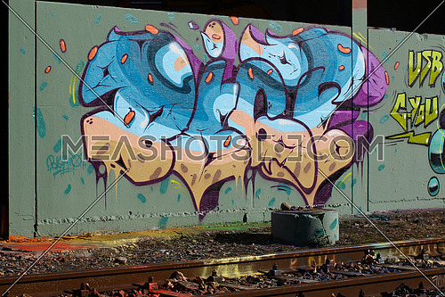 Cadenazzo, Switzerland, February 2016, Urban wall texture along railroad tracks keep popping up along railway tracks, graffiti art abstract background