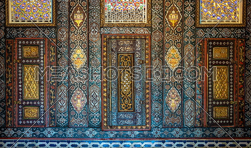 Floral ornaments of wooden embedded cupboards painted with colored geometrical patterns, Syrian hall of historic Manial palace of Prince Mohammed Ali, Cairo, Egypt