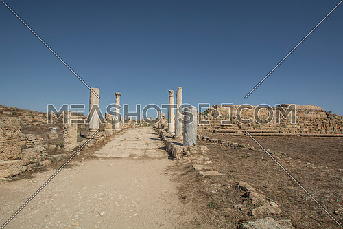 Ruins and columns of ancient Salamis city before rain on a coast of Mediterranean Sea on Cyprus island.