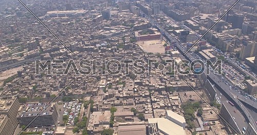 Reveal shot Drone for Cairo City showing Traffic and Bridges in Cairo Downtown at Day