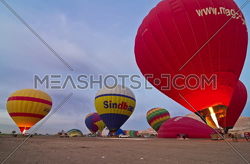 Fixed shot for Hot Air Ballons prepare to fly in Luxor