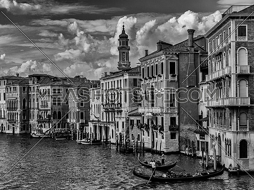 a scenic black and white cityscape shot showing venetian buildings on the grand canal