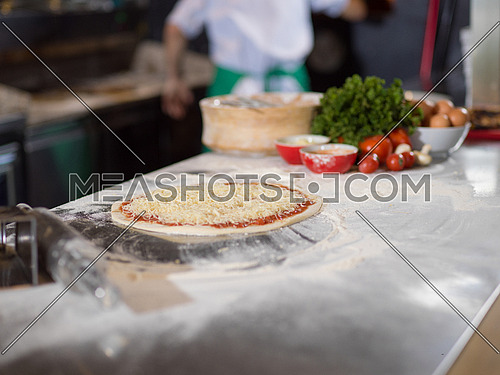 raw pizza margarita prepared for roasting