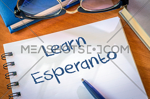 Learn Esperanto written in a notepad. Education concept
