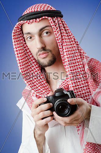 Arab photographer in studio shooting