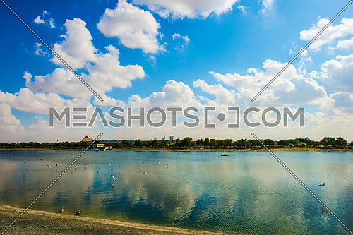 Blue sky and clouds reflected on a lake