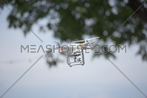 aerial photography,  quadcopter  drone flying over the city. New digital photo and video technology