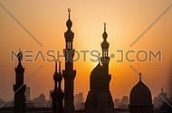 A sunset timelapse of Islamic Cairo showing the sun setting off behind mosque minarets