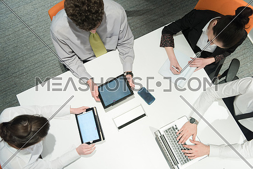 aerial top view  of business people group brainstorming on meeting and businessman presenting ideas and projects on laptop and tablet computer