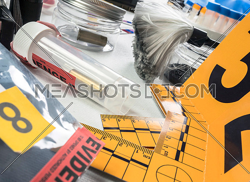 Identification Numbers, various laboratory evidence forensic equipment, conceptual image