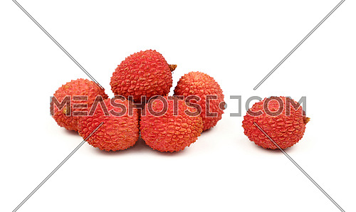 Group of fresh red ripe litchee (Litchi chinensis) tropical fruits isolated on white background, detail close up in different perspectives, low angle view
