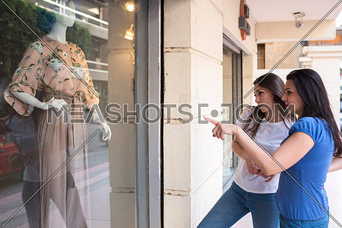 two young ladies shopping in korba area at day