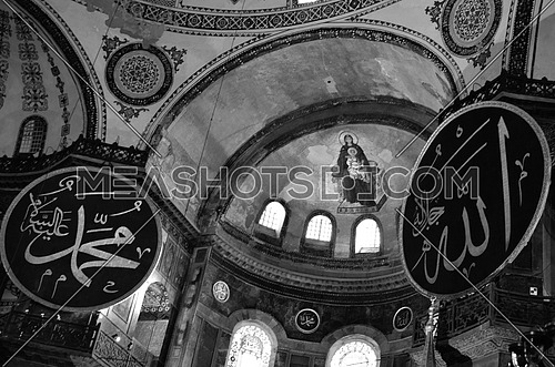 the inside of Hagia Sophia the famous historical land mark in Istanbul Turkey and the writings of Allah :God and prophet Mohamed appears on the walls.