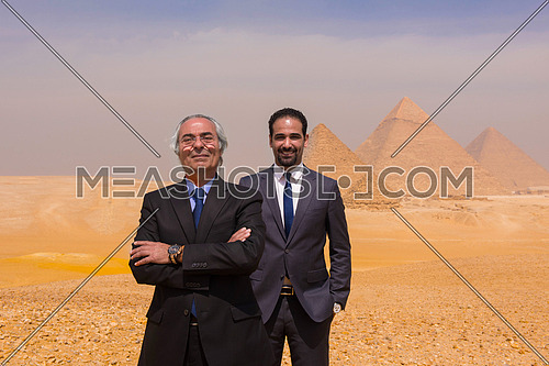 successful arab business people at Egyptian giza platou with pyramids in backgronud