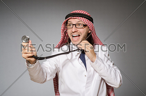 Funny arab doctor with stethoscope