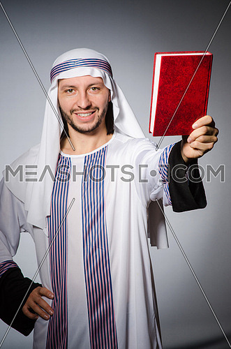 Arab man with book in diversity concept