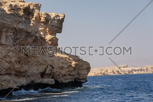 Close up shot from Red Sea showing Ras Muhammed Island by day