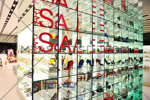woman shoes in mall market store on sale